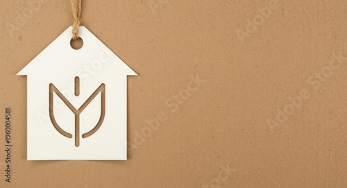 Bio energetic house symbol on eco paper vertical banner with cardboard texture background and designated text space