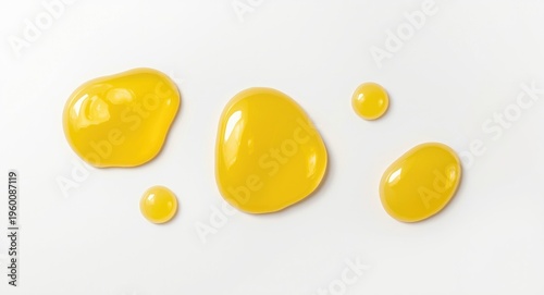 Shiny yellow gel blobs on a...