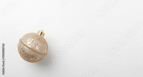 Holiday bauble lying on pri...