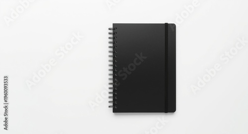 Black spiral notebook on a ...