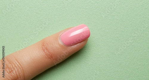 Pink fingernail with a slee...