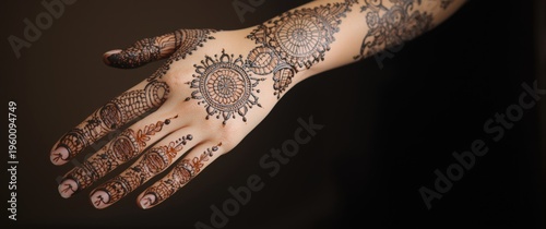 Hand covered in intricate h...