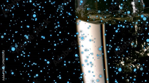 Animation of champagne pouring in flute and blue circles moving on black background