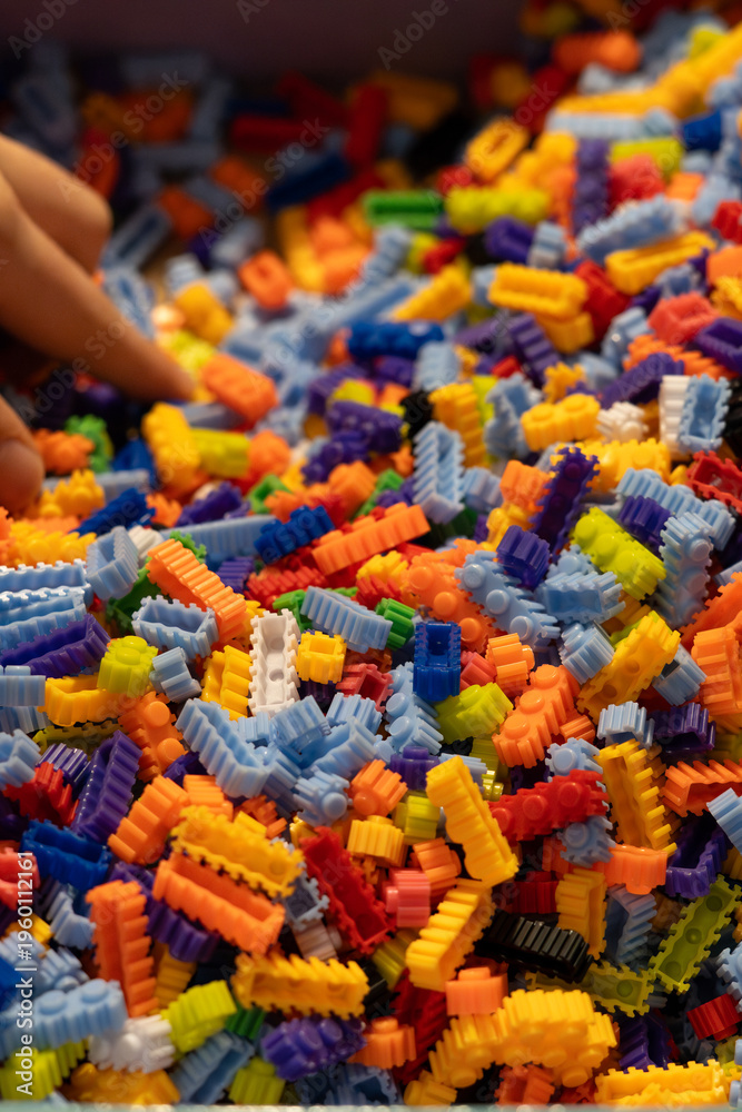 Obraz premium Multi-colored small LEGO construction pieces.