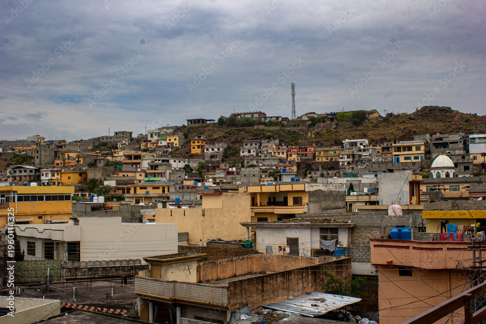 Fototapeta premium Hillside houses in Bara Kahu Islamabad urban landscape