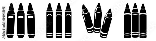 Set of colorful wax crayons arranged in rainbow order on black background minimalist art supplies creative education