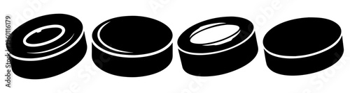 Set of four black hockey pucks isolated on white background for sports equipment and ice hockey training