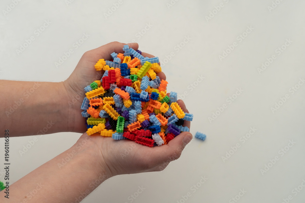 Obraz premium Multi-colored small LEGO construction pieces.
