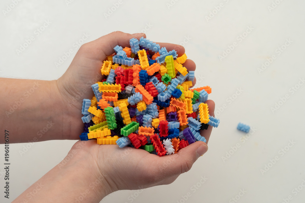 Obraz premium Multi-colored small LEGO construction pieces.