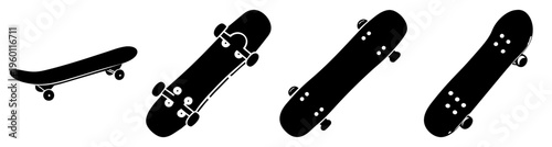 Set of four black skateboards with grip tape aligned horizontally on white background for sports and urban lifestyle