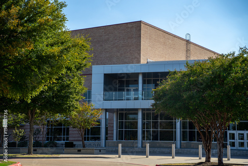 Brick and Glass Building With Trees and Sidewalk in Allen, Texas