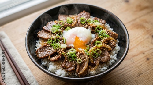 Savory Beef Bowl: A culinary masterpiece features tender slices of succulent beef, beautifully arranged atop a bed of fluffy rice, crowned with a perfectly poached egg and vibrant scallions.