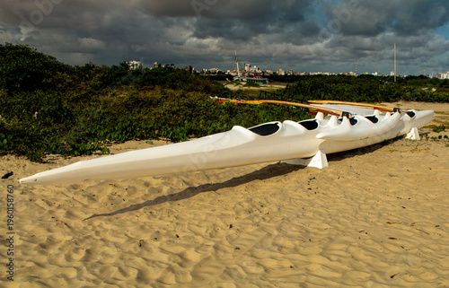 Hawaiian or Polynesian canoe, stranded on the sand of Ponta d'Areia beach, in São Luís, MA, Brazil.