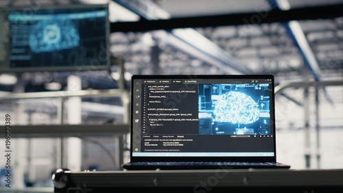 Φωτογραφία AI coding script running on laptop managing server farm mainframes powering networks