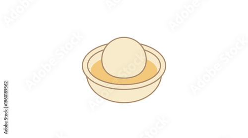 An egg submerged in a bowl of broth