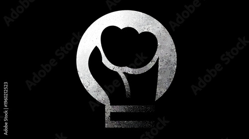 A metallic textured emblem of a closed fist within a circle, with a dark background