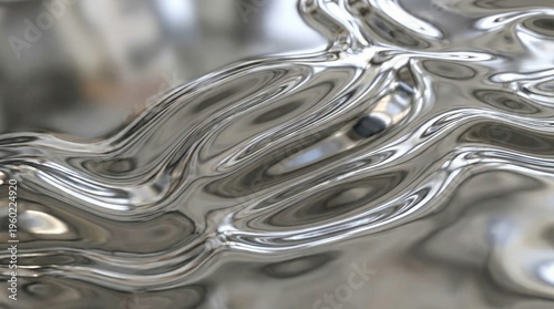 Glossy liquid metal texture with reflections and ripples, abstract chrome surface.