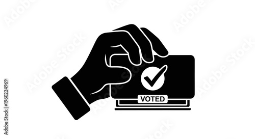 Hand holding voted sticker closeup.