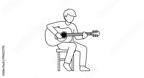 Man sitting and playing guitar.