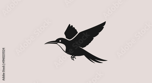 A black silhouette of a bird flying.
