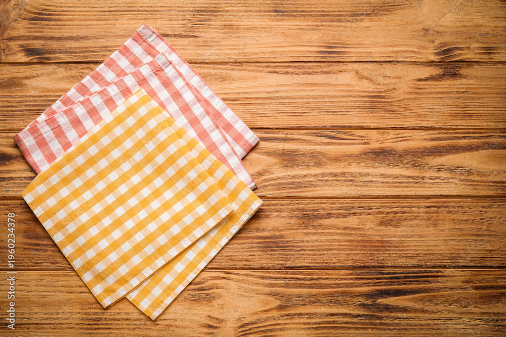 Obraz premium Checkered napkins on wooden table