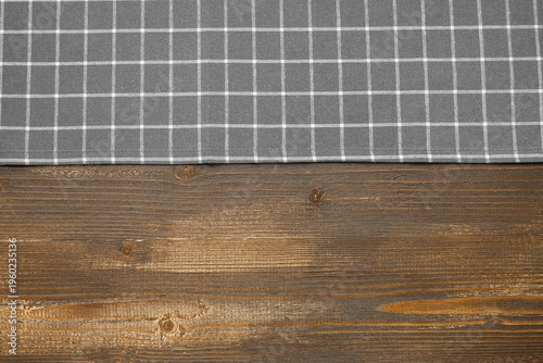Grey checkered napkin on wo...