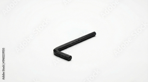 Black hex key or Allen wrench isolated on white background, L-shaped tool, assembly equipment, maintenance hardware.