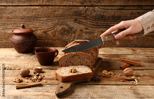 Woman cutting delicious wal...