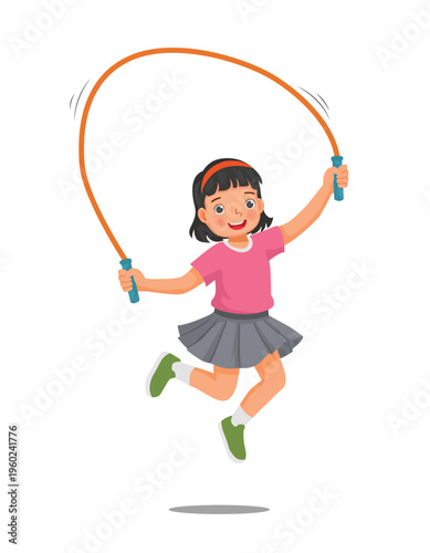 Little girl doing jumping rope exercise 