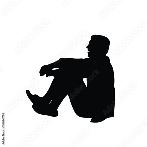 Silhouette of a man sitting on the ground hugging his knees and laughing or talking, joyful relaxed person in a casual pose isolated on white background
