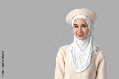 Stylish Muslim woman in whi...