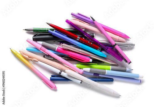 Many different pens on whit...