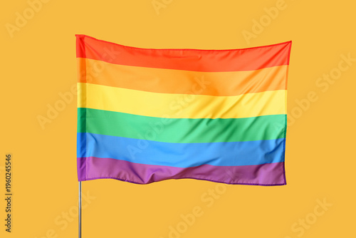 Waving LGBT flag on yellow ...