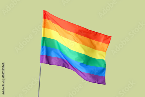 Waving LGBT flag on yellow ...