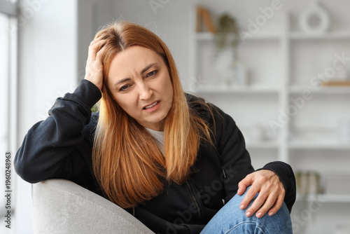 Angry mature woman sitting ...