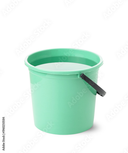 Green bucket of water on wh...