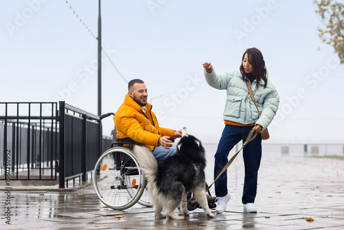 Young man in wheelchair wit...