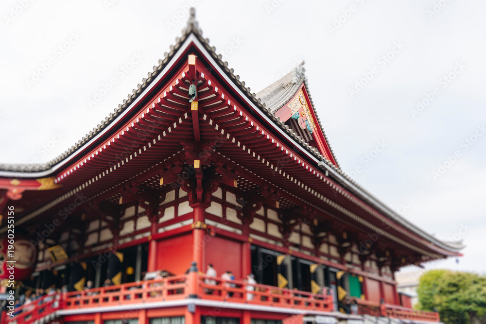 Fototapeta premium Senso-Ji temple in Asakusa district, Taito City, Tokyo, Japan, Asakusa Kannon, Kinryu-zan Buddhist temple shrine in autumn fall day, with Nakamise shopping street, Kaminarimon Gate and Hozomon