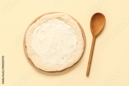 Pizza dough with tasty sauc...