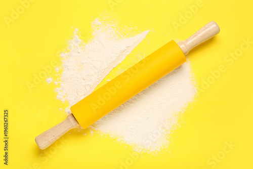 Yellow rolling pin with flo...