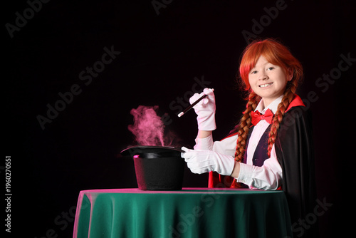 Young magician showing magi...