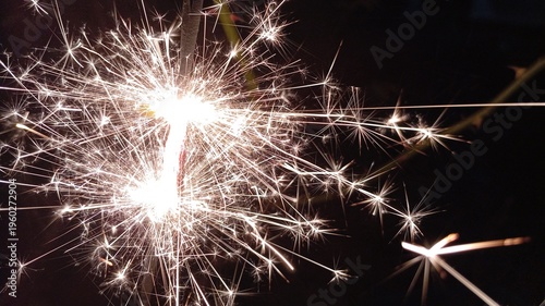 Bright spark emissions function as decorative elements and entertainment tools in celebrations providing magical warm and joyful ambiance throughout the night