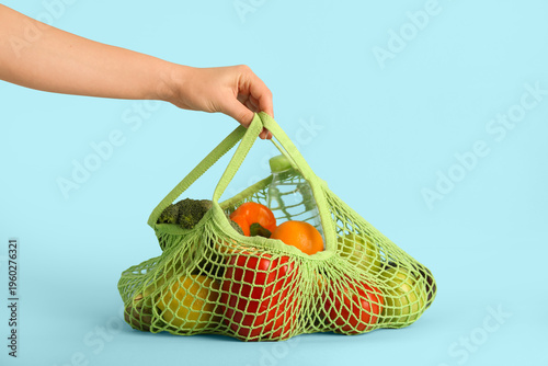 Female hand with vegetables...