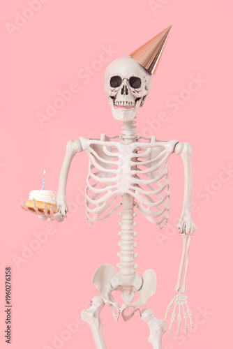 Human skeleton in party hat...