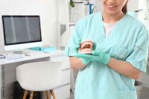 Young happy female dentist ...