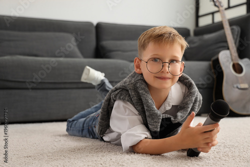 Cute little boy with microp...