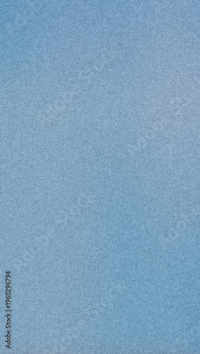 Close-up of fine blue grain texture with subtle tonal variations, offering a versatile minimal background ideal for print design, packaging, or modern digital layouts.