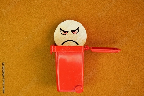 Fotografie Red trash can with angry face icon