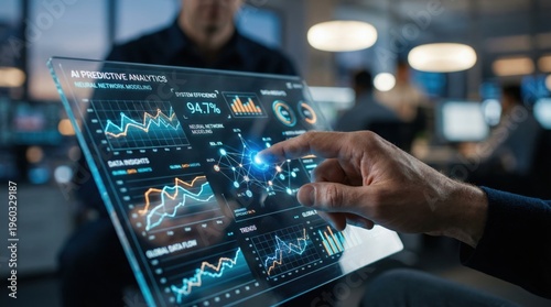 Businessman analyzing data on a digital screen in a modern office