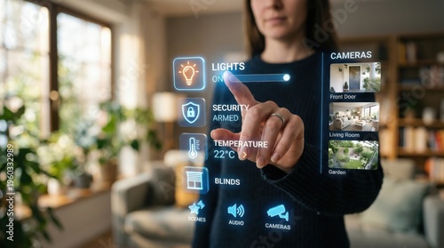Woman controlling smart home system with smartphone in living room